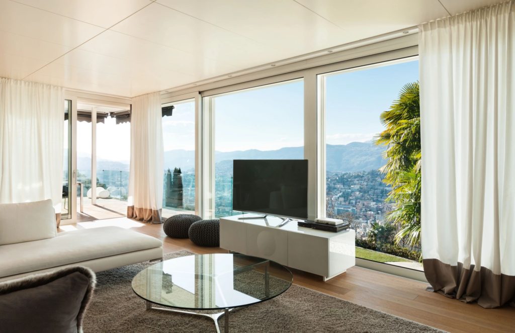 a living room with a view of the city